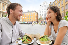 Cafe Couple Eating Food Sandwiches In Stockholm