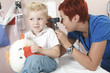 © Louis-Paul Photo - A Doctor Examining cute little boy