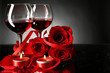 Composition with red wine in glasses, red rose and decorative