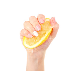 Poster - Female hand squeezing lemon isolated on white