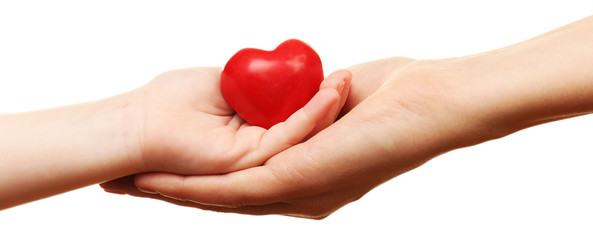 Wall Mural - Heart in child and mother hands isolated on white