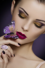 beautiful woman with bright makeup and butterflies