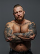 © Fxquadro - Strict brutal male with beard and tattooes