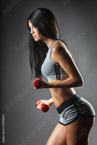 Obraz w ramie Sports young woman with dumbbells