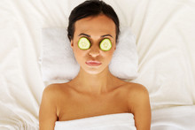 Woman Enjoying Spa, Having Cucumber On Eyes
