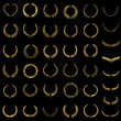 Set of gold award laurel wreaths and branches on dark background