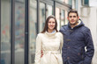 © bokan - Portrait of young couple standing on the street