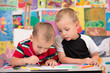 © tamara83 - Two brothers enjoy drawing with felt tip pens.