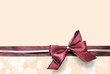 © Africa Studio - Satin ribbon bow on color background