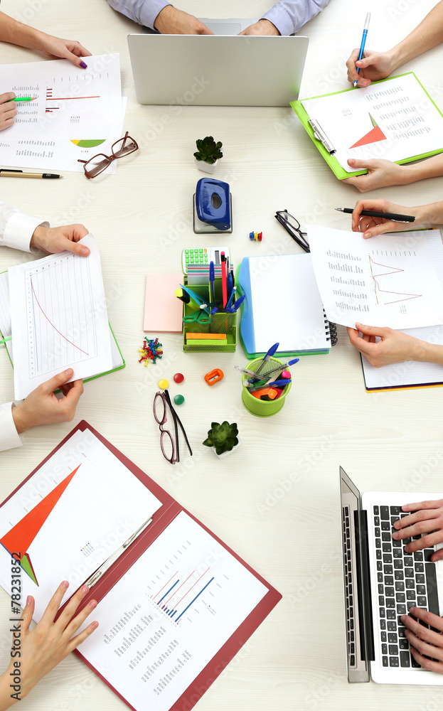 Group of people working at desk top view