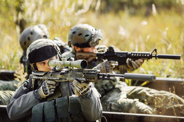 Wall Mural - soldiers shoot at a target from the weapon