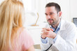 © Production Perig - Young attractive doctor listening his patient