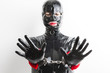 © Richard Semik - portrait of woman wearing latex clothes with handcuffs