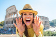 Happy woman shouting through megaphone shaped hands  in Rome