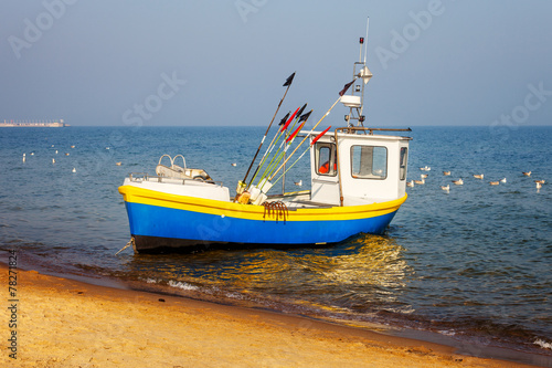 Naklejka na drzwi Fishing boat on the beach in Sopot, Poland.