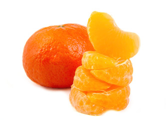 Wall Mural - A ripe and fresh mandarin or tangerine and five stacked slices