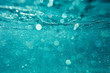 © shevtsovy - abstract underwater background with bokeh