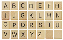 Alphabet Letters On Wooden Scrabble Pieces, Isolated On White.