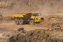 Truck And Bulldozer Work In The Quarry