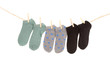 © Fotos 593 - socks hanging on a rope clothesline