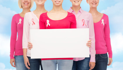 Wall Mural - close up of women with cancer awareness ribbons