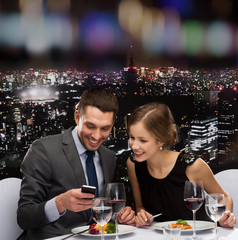 Sticker - smiling couple eating main course at restaurant