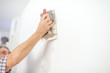 © Gajus - Man plastering a white wall