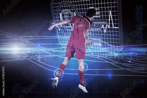 Fototapeta na szkło Composite image of fit football player jumping up