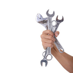 Wall Mural - spanners in a man hand isolated on white background