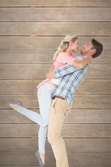 Poster - Handsome man picking up and hugging his girlfriend