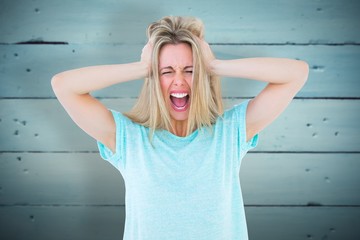 Wall Mural - Composite image of furious blonde standing and yelling