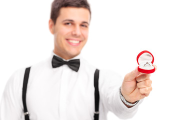 Wall Mural - Young man proposing with a diamond ring