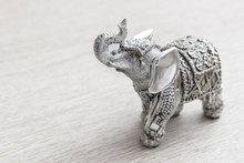 Indian Elephant Figurine On Wooden Table