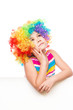 © julaszka - Girl in clown is holding blank banner