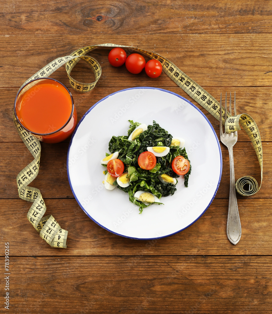 Salad with quail egg and basil in plate