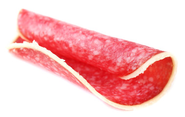 Wall Mural - Slice of salami isolated on white background