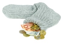 An Old Woolen Sock Full Of Euro Money On A White Background