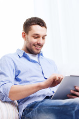 Sticker - smiling man with tablet pc and cup at home