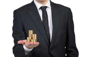 Businessman handing gold coins