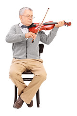 Sticker - Senior gentleman playing a violin seated on a chair