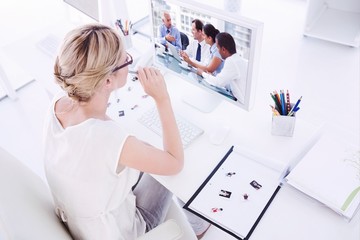 Wall Mural - Composite image of female photo editor working on computer