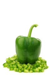 Wall Mural - green bell pepper  and already cut pieces of paprika coming out