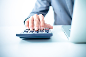 Closeup of businessman hands typing on laptop computer