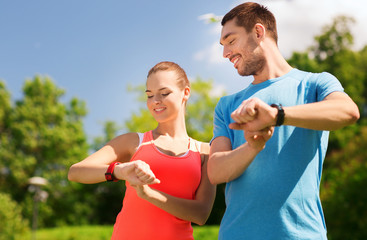 Sticker - smiling people with heart rate watches outdoors