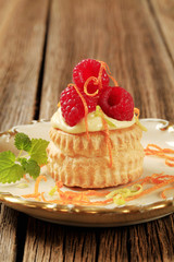 Wall Mural - Custard filled puff pastry shell with raspberries