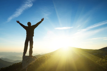 winner on mountain top. sport and active life concept..