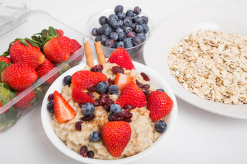 Wall Mural - Oatmeal with Blueberries Strawberries and Cinnamon