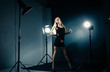 © julenochek - Beautiful woman posing at studio in light flashes
