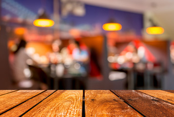 Wall Mural -  wood  table and  Coffee shop blur background with bokeh image