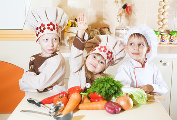 three children prepare food in the kitchen.Interior photography